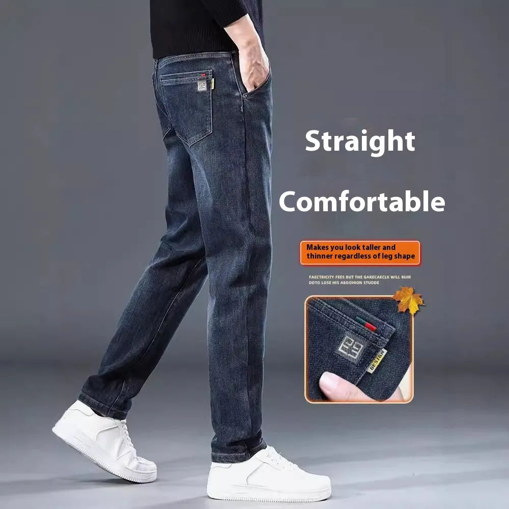 Man wearing blue grey slim straight casual trousers with a loose fit and zip fly for summer street fashion
