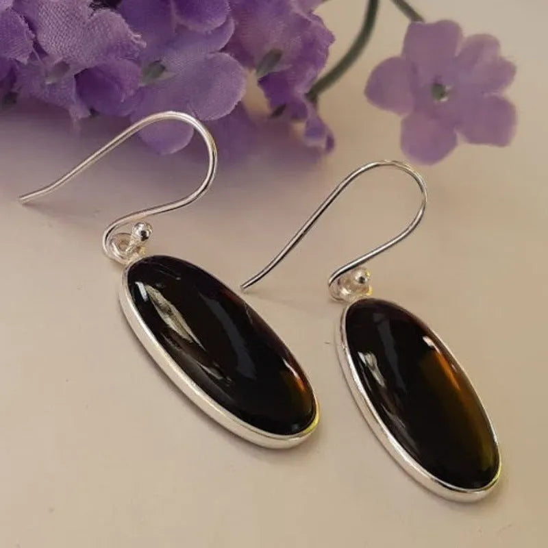 Women's oval black agate pendant earrings with geometric Chinese design on silver-style alloy