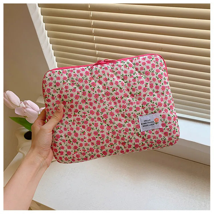 Cloth laptop bag in floral and heart patterns showing three size options with anti-seismic protection