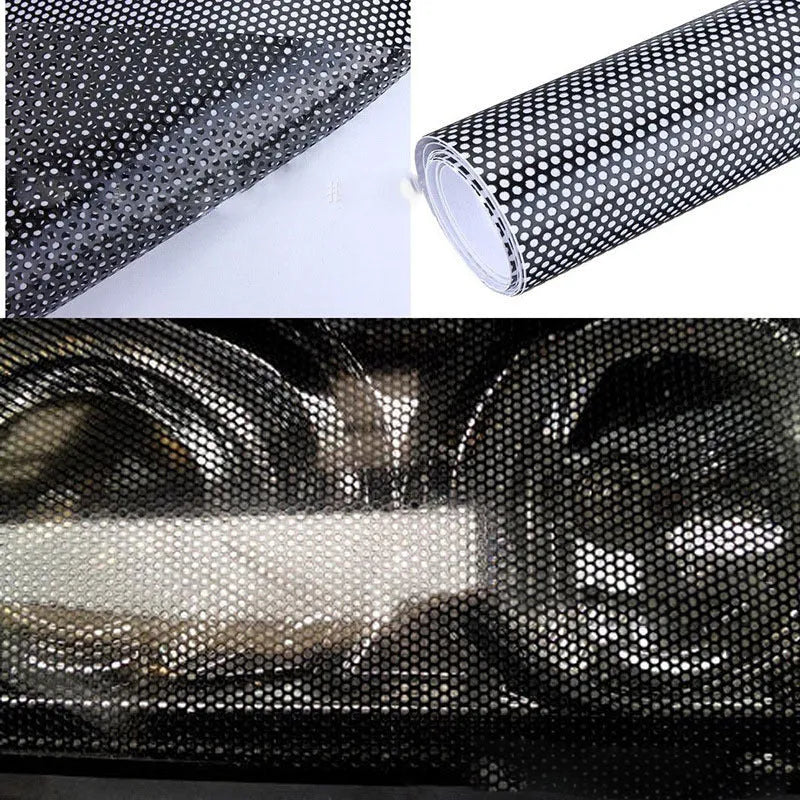 Roll of black perforated automotive vinyl wrap film showing mesh texture and scale.