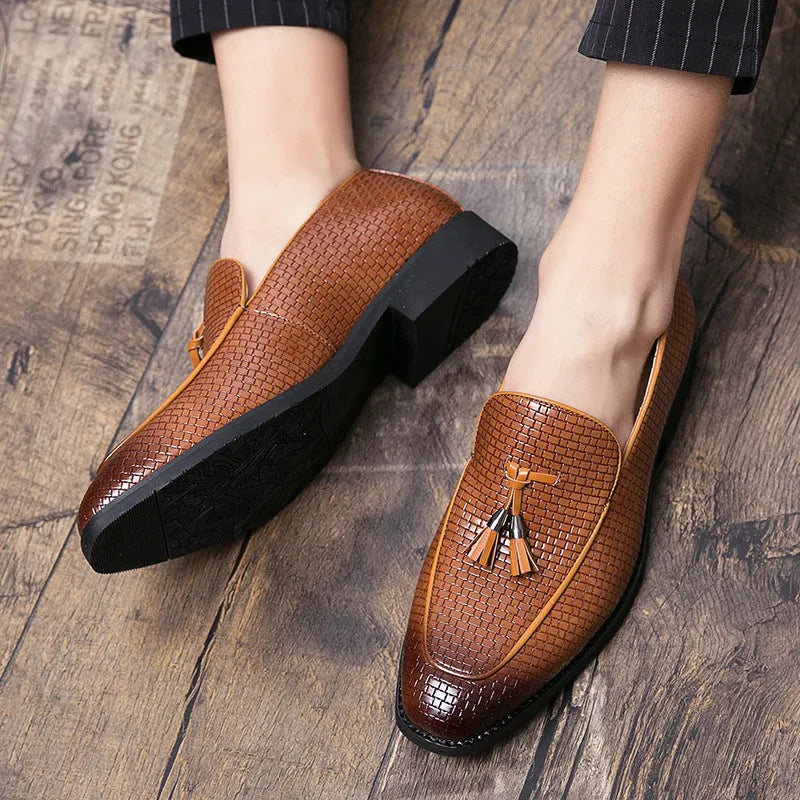 Men's black slip-on shoes with pointed toe and tassel decoration on artificial PU upper