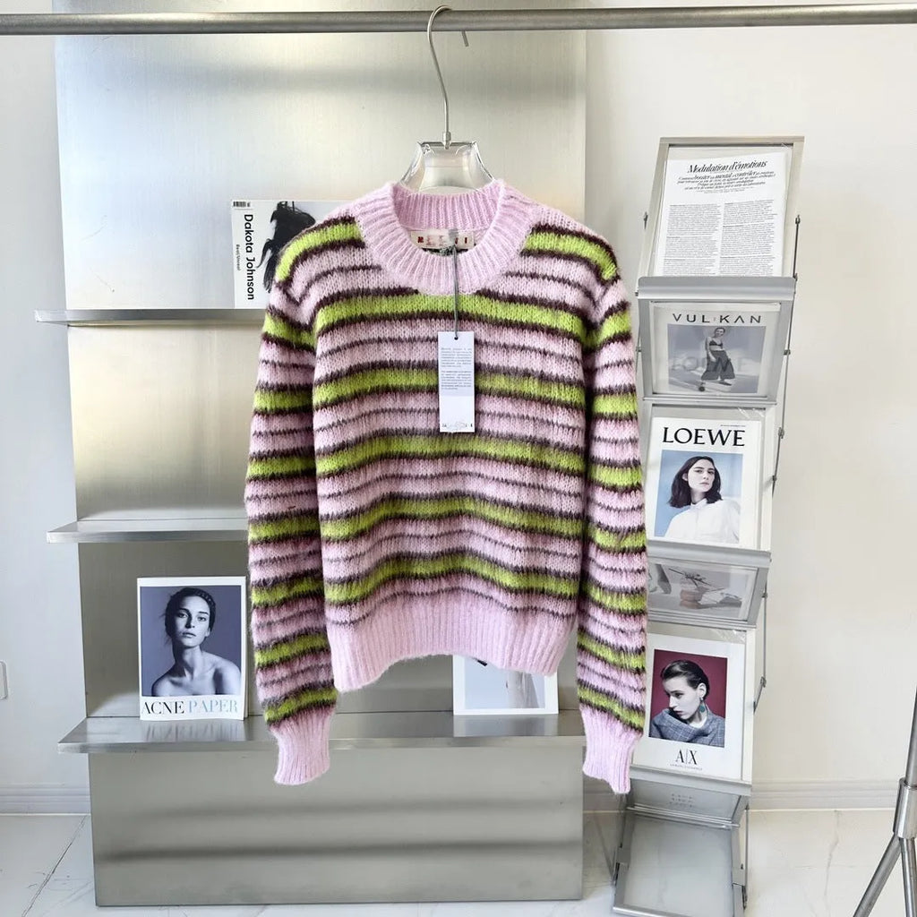 Pink wool knitted cardigan sweater on a hanger, showing round neck and cardigan style options.