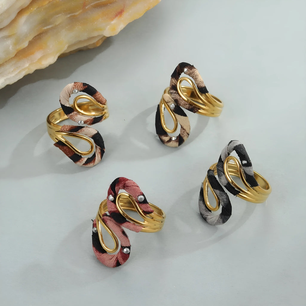 Geometric leopard print open mouth ring in stainless steel, shown in various colour options.