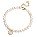 Women's freshwater pearl bracelet with fan-shaped alloy shell and choice of elastic or chain closure