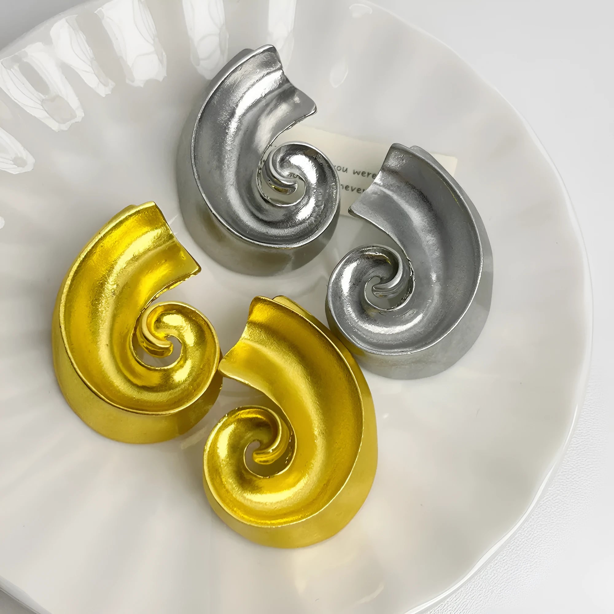 Retro geometric alloy ear studs in gold or silver colours measuring 5cm