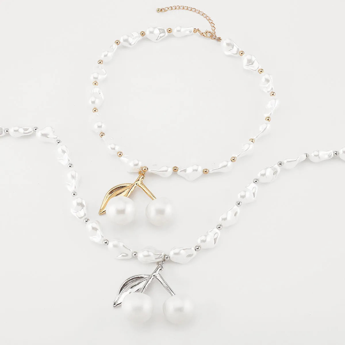 Gold electroplated alloy fruit necklace with pearl chain adjustable from 51cm to 60cm