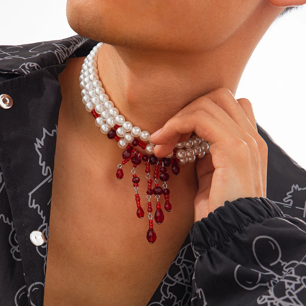 Men's Halloween necklace with red and black crystal blood drop pendant and pearl tassels on an adjustable chain