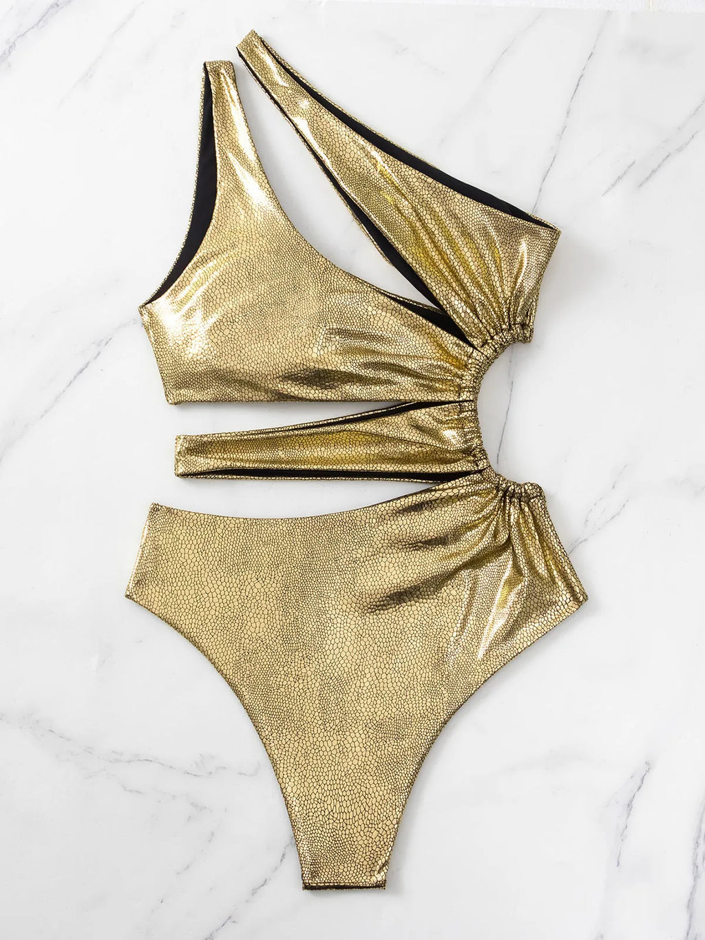 Women's gold one-piece swimsuit with backless design and spandex lining for swimming activities