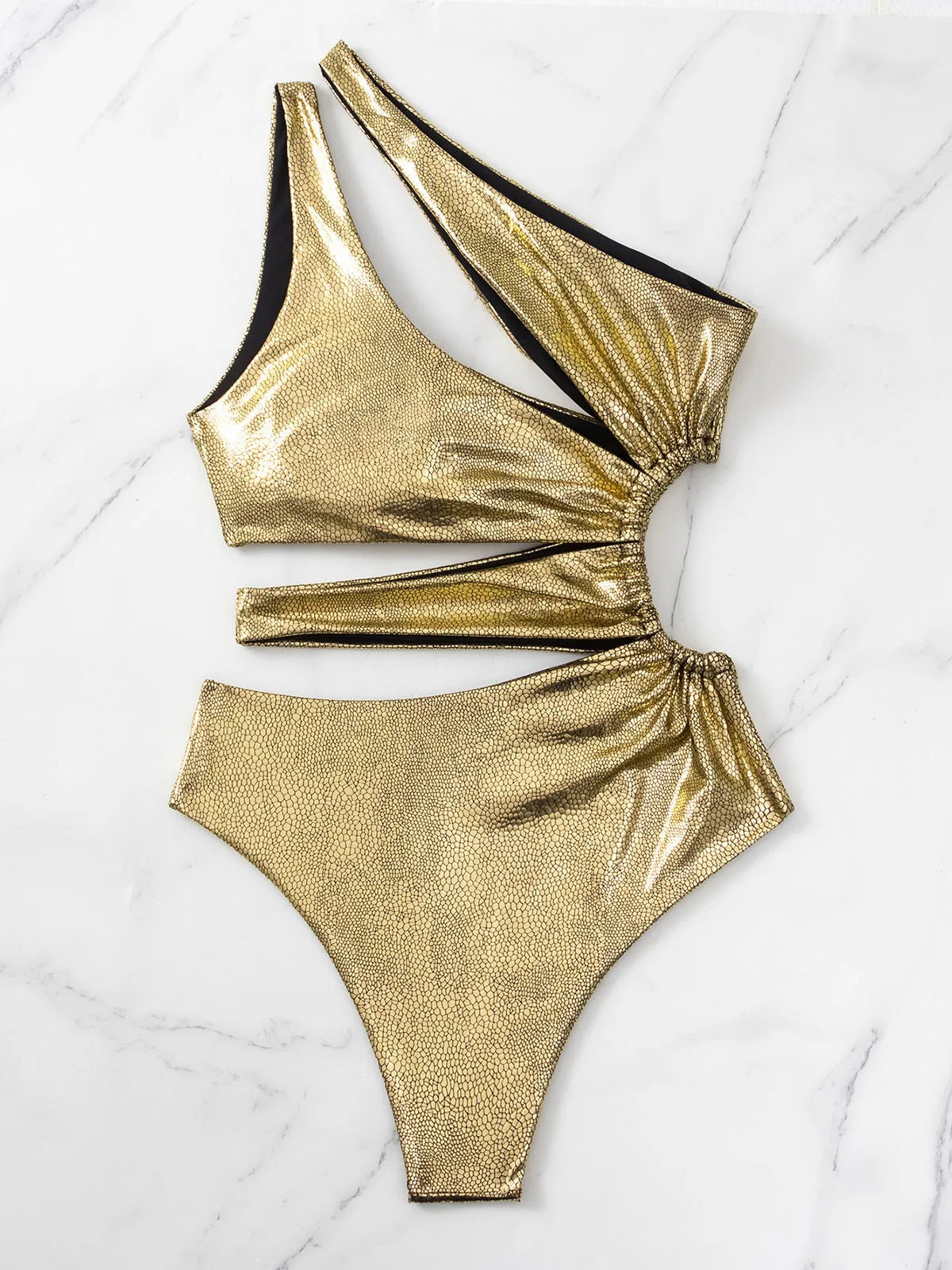 Women's gold one-piece swimsuit with backless design and spandex lining for swimming activities