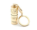 Gold zinc alloy waterproof mini LED flashlight on a keychain.