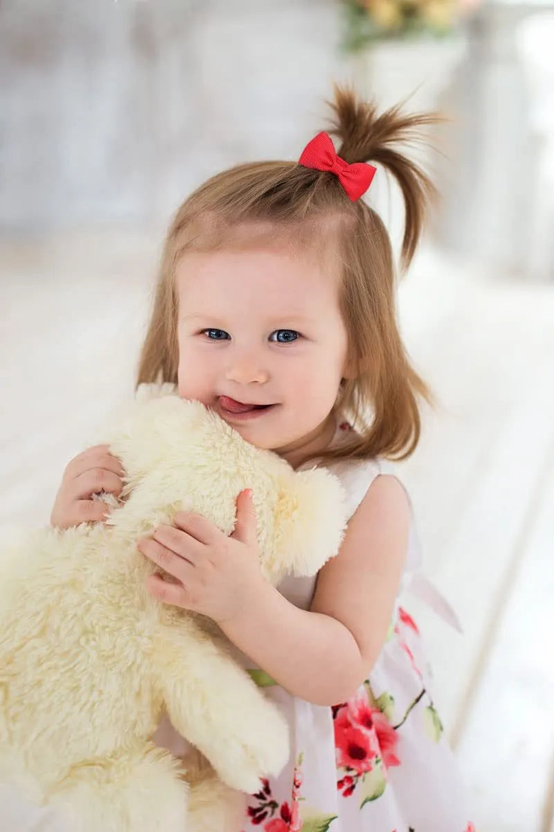 80 piece set of tiny multi-coloured grosgrain ribbon hair bows and matching soft elastic bands for babies and toddlers.