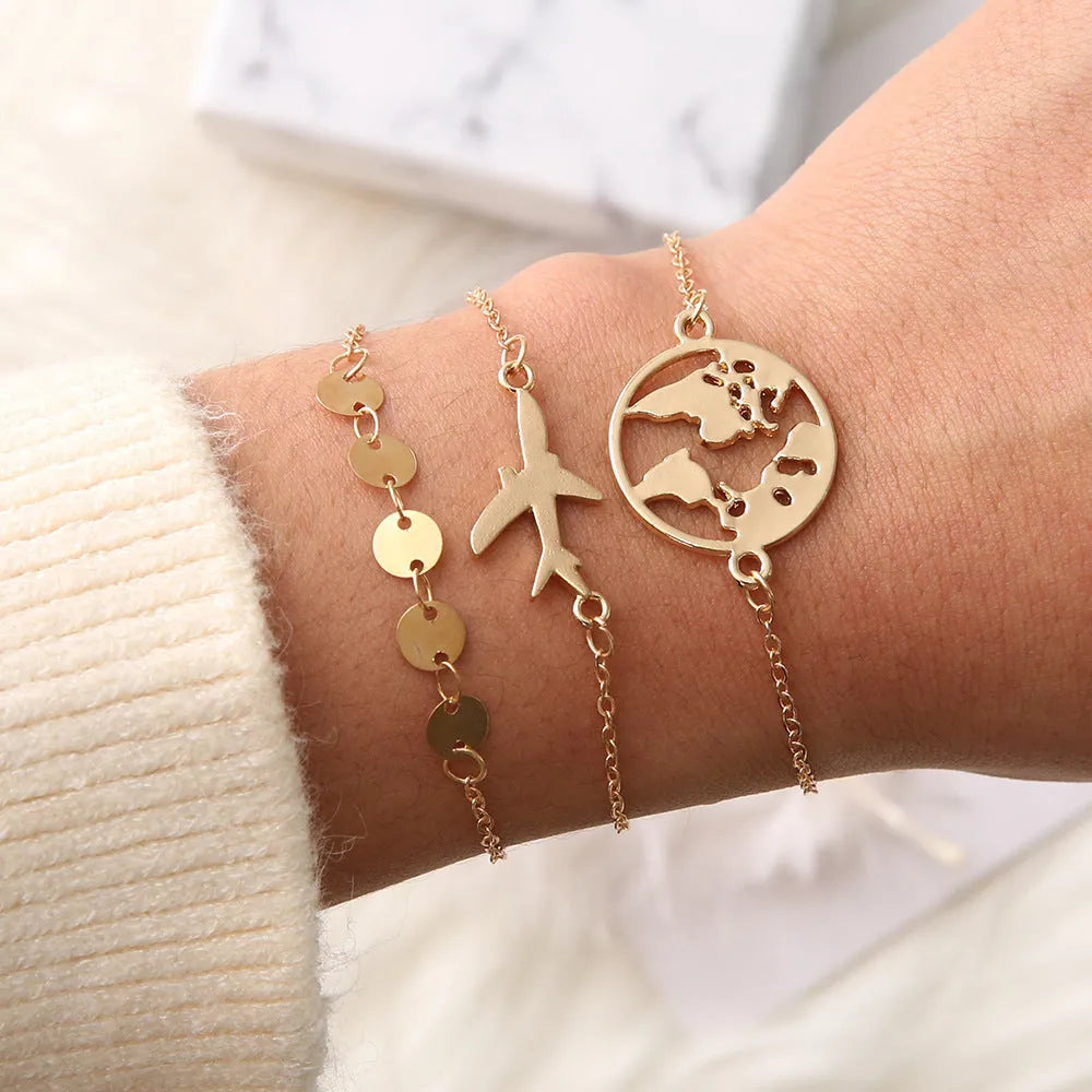 Three women's bracelets with European and American aircraft map charms in heart shape design