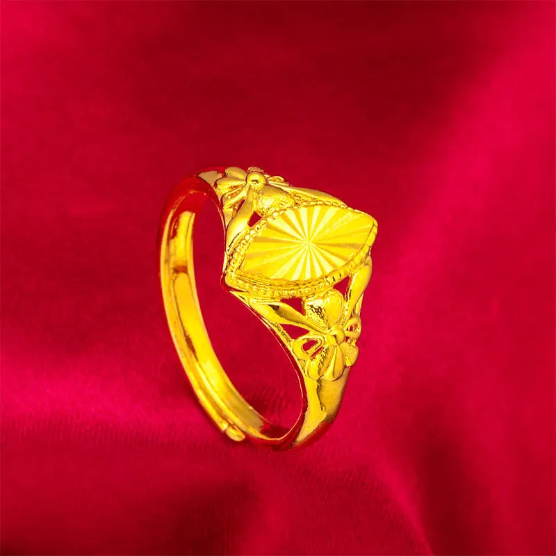 Geometric gold flower ring with open setting and textured details on brass base