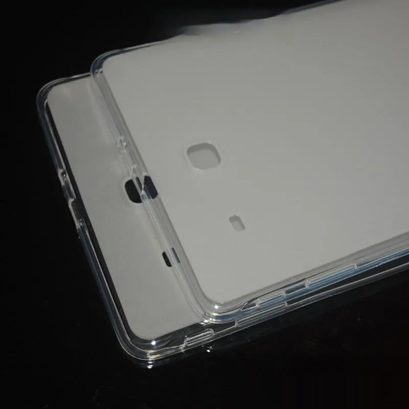 Clear transparent ultra-thin silicone hard shell case for a tablet on a flat surface.
