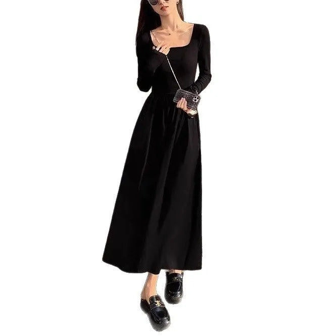 Women's black square collar A-line knitted dress with long sleeves and elastic waist.