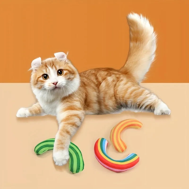 Striped green, rainbow, and yellow cat pillow toys with a built-in catnip strip and noise maker.