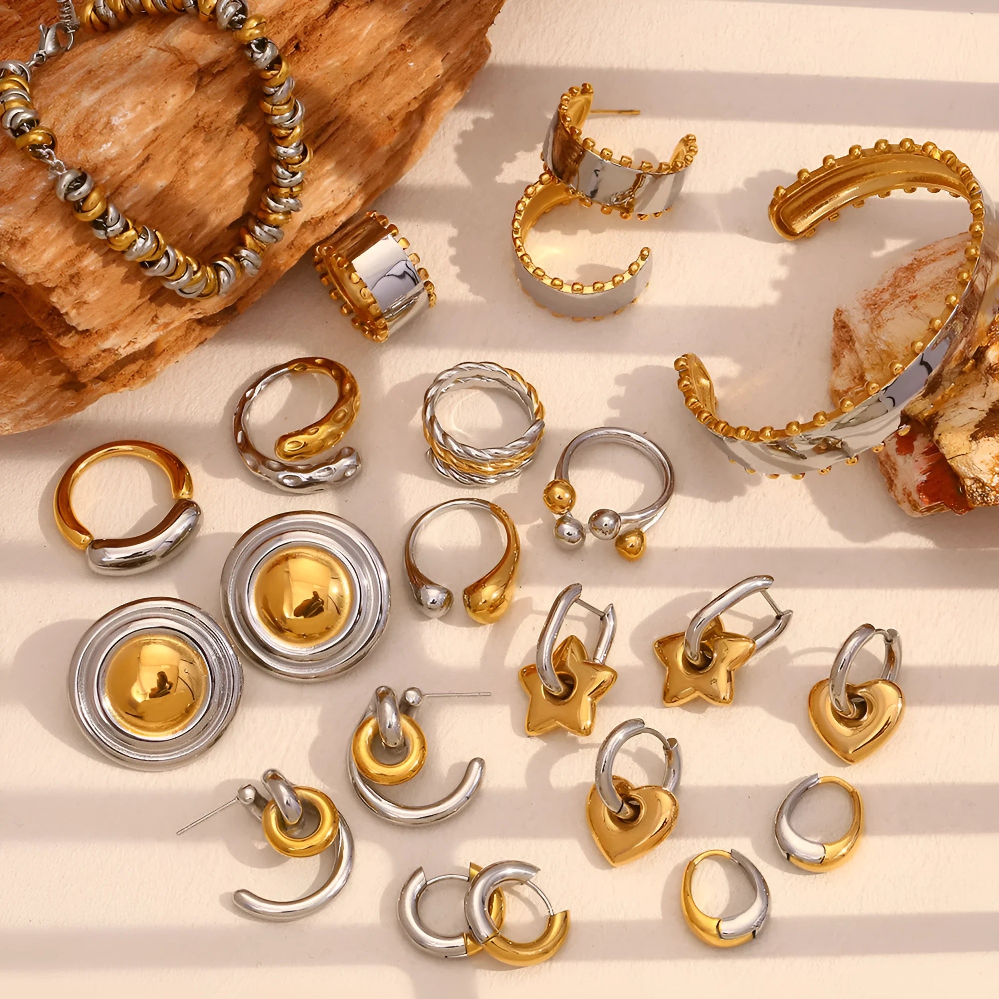 Geometric gold electroplated jewellery set showing earrings, bracelet and necklace with rounded ring elements