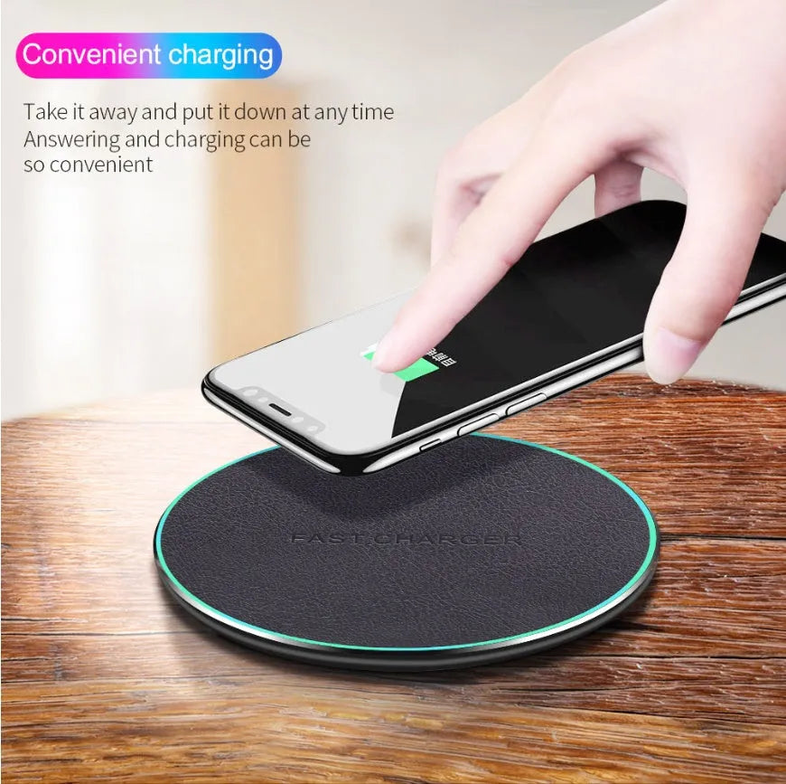Black circular Qi wireless charging pad for iPhone 11 with non-slip surface
