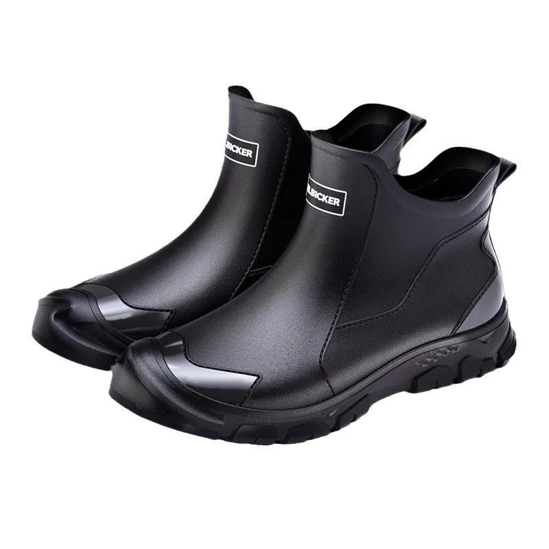 Pair of solid colour low tube PVC wading shoes with a round toe and non-slip plastic sole.
