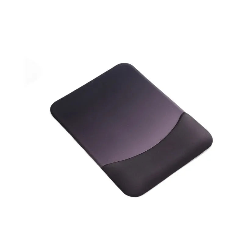 Square blue cloth silicone wrist rest mouse pad on a desk.
