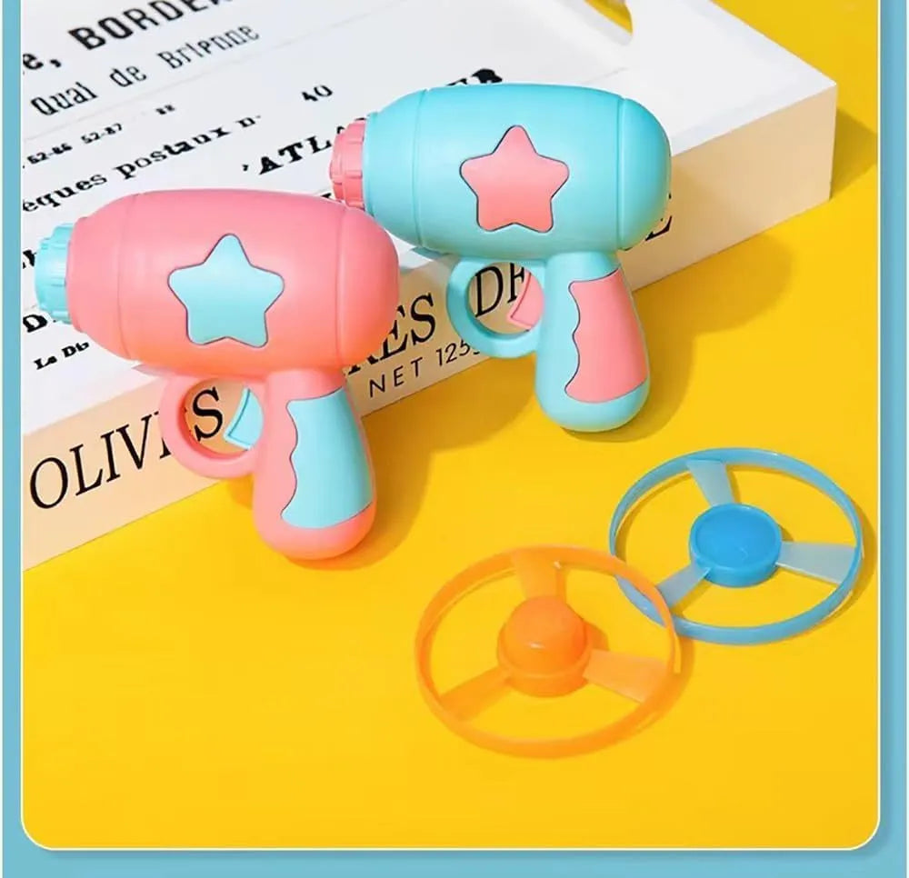 Blue or pink plastic cat toy gun with two Frisbee discs for indoor play.