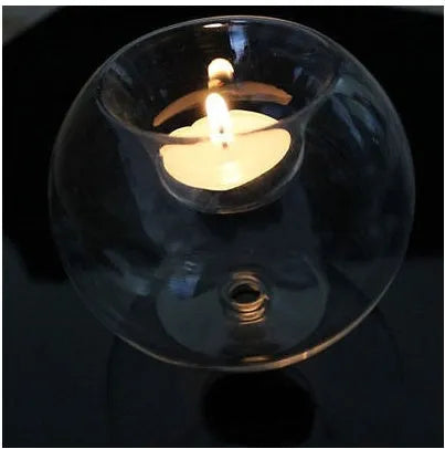 Handmade European style round hollow glass candle holder in three sizes.