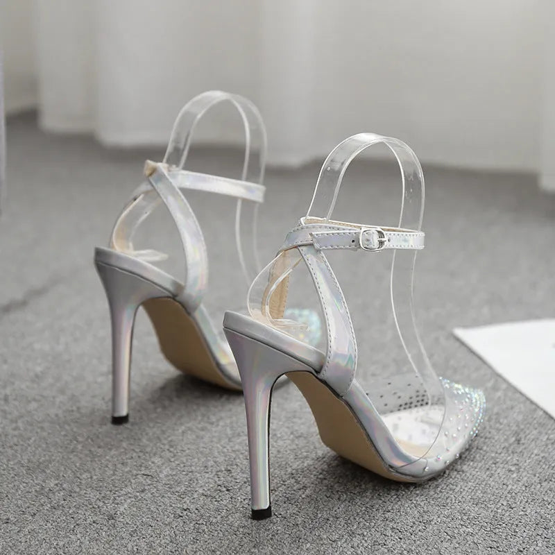 Women's pointed toe diamond sandals with a stiletto heel, showing PVC upper material.