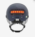 Cycling helmet with integrated rear LED brake light and tail light, shown in size M and L.