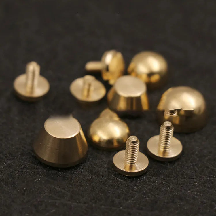 Brass decorative foot nail buckle in round and geometric designs, sizes 10x6mm and 12x7mm.