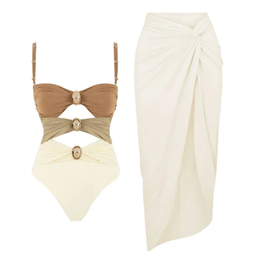 Women's solid colour one-piece swimsuit with matching skirt and gold button detail in assorted colours