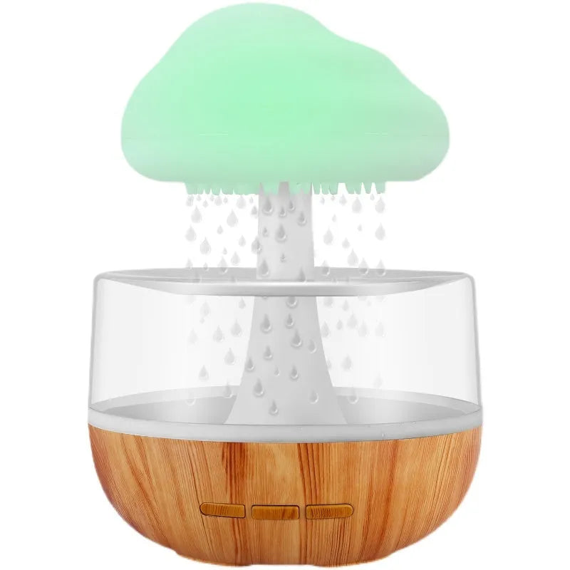White raining cloud humidifier with essential oil diffuser and multi-colour night light on table