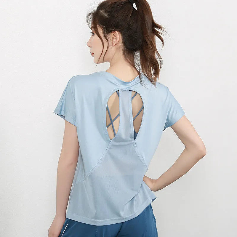 Women's polyester sports t-shirt in pink colour with short sleeves for yoga and running activities