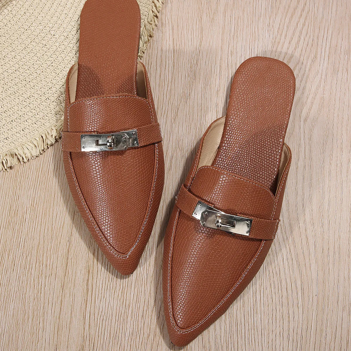 Light brown women's pointed-toe casual slip-on shoes with a low heel and rubber sole.