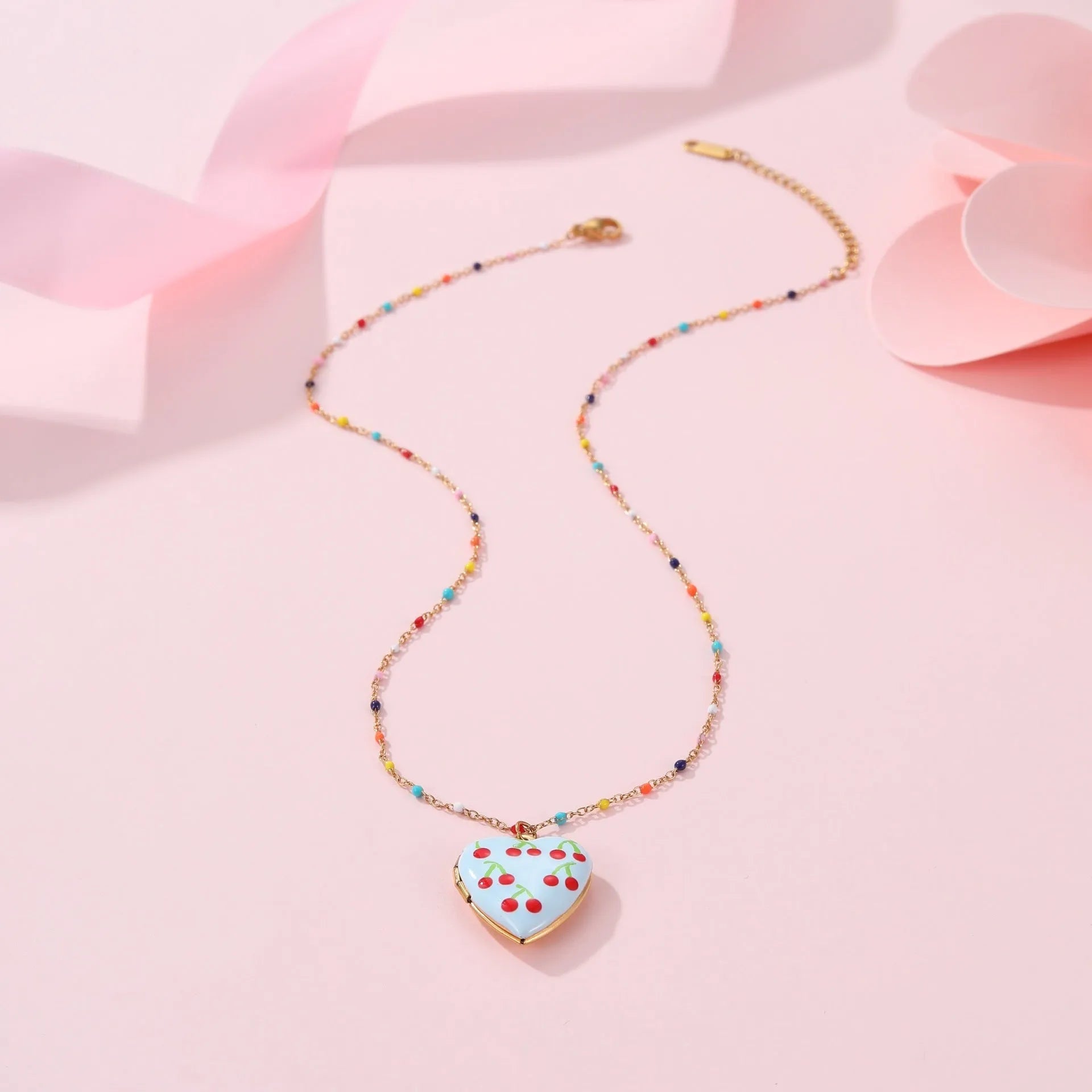 Gold plated fruit charm necklace with heart-shaped pendant on adjustable stainless steel chain