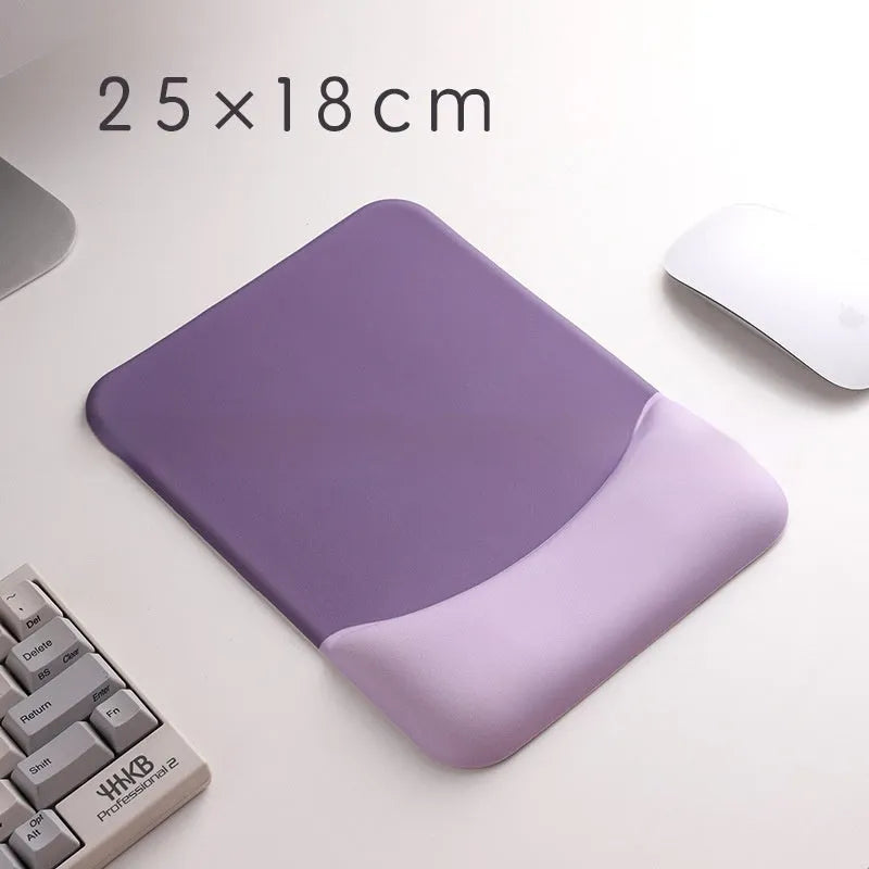 Square blue cloth silicone wrist rest mouse pad on a desk.
