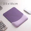 Square blue cloth silicone wrist rest mouse pad on a desk.
