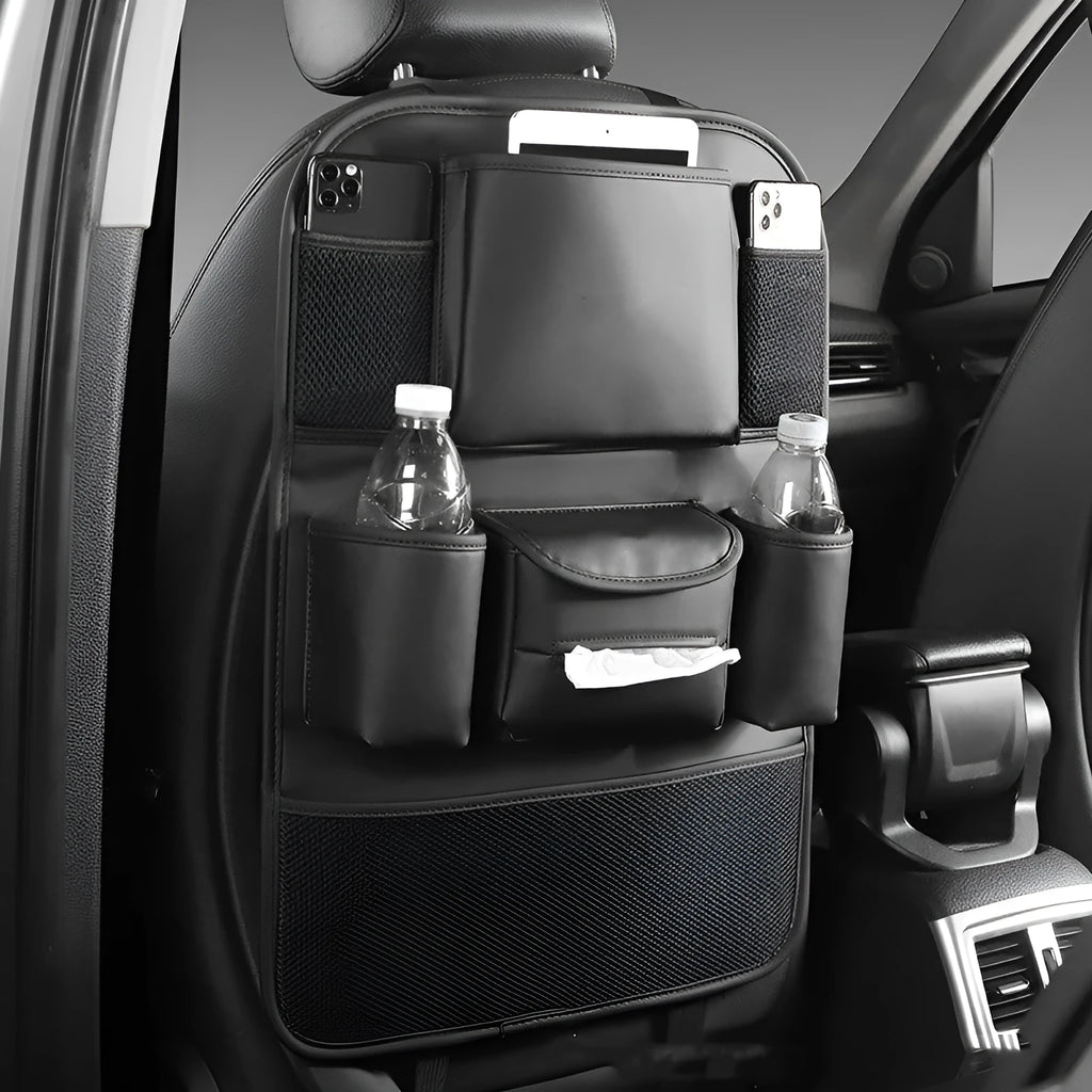 Black leather storage bag hanging on the back of a car seat.