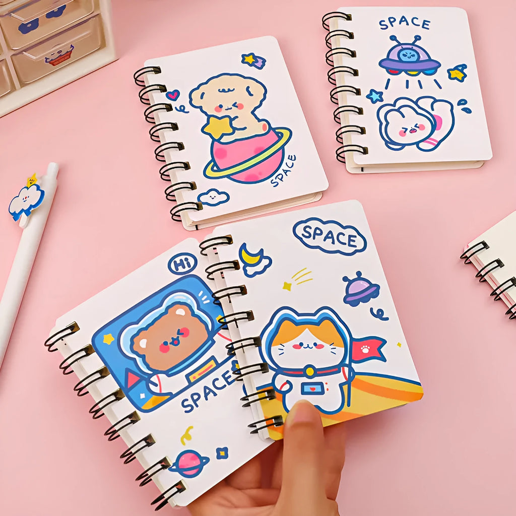Astronaut themed pocket notebook showing 10.5 x 8 cm dimensions with space decoration