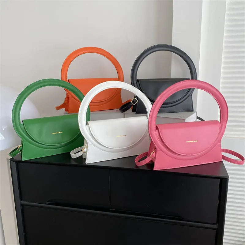 PU leather messenger bag with sandwich pockets and visible stitching in multiple colour options