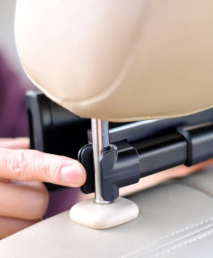 Black universal car phone holder attached to vehicle rear seat base with tablet mounted