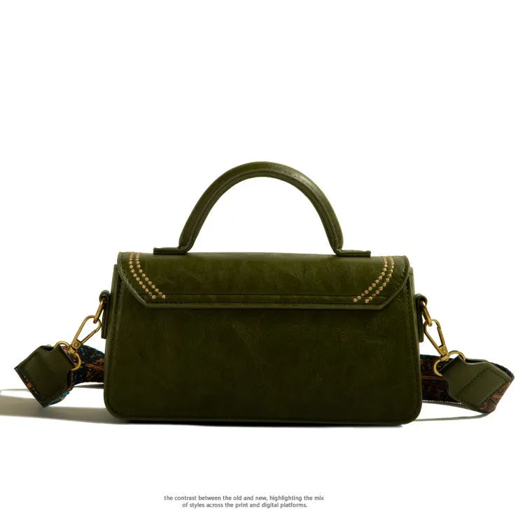 Women's brown retro messenger bag showing square vertical shape and adjustable shoulder strap