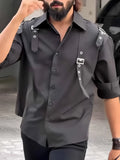 Men's black utility-style button-up shirt with regular fit and polyester construction