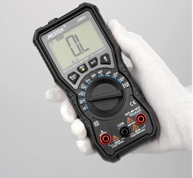 DM90A digital multimeter with LCD display showing measurement readings