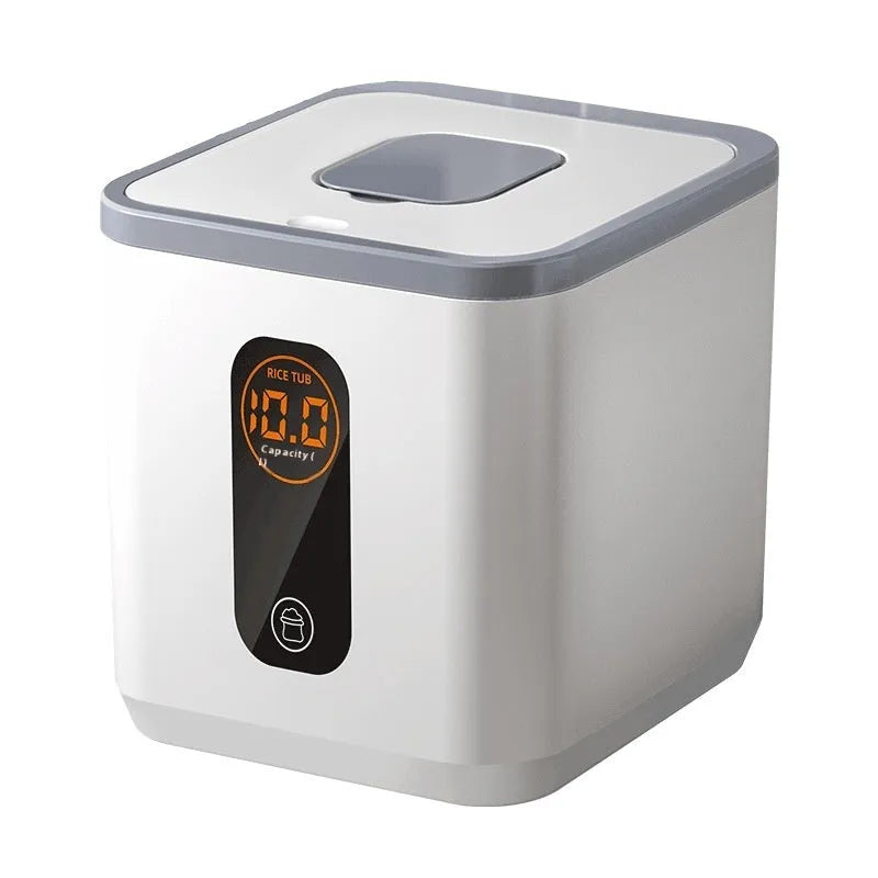 Grey plastic airtight rice storage jar with a lid and a free measuring cup on a kitchen counter.