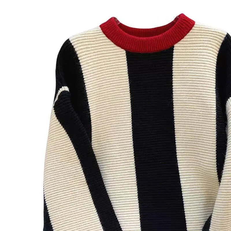 Women's striped cashmere pullover sweater with round neck in contrast colours.