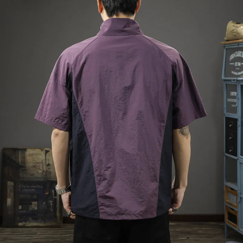 Brown men's loose-fit T-shirt with a half-zip stand collar and short sleeves.