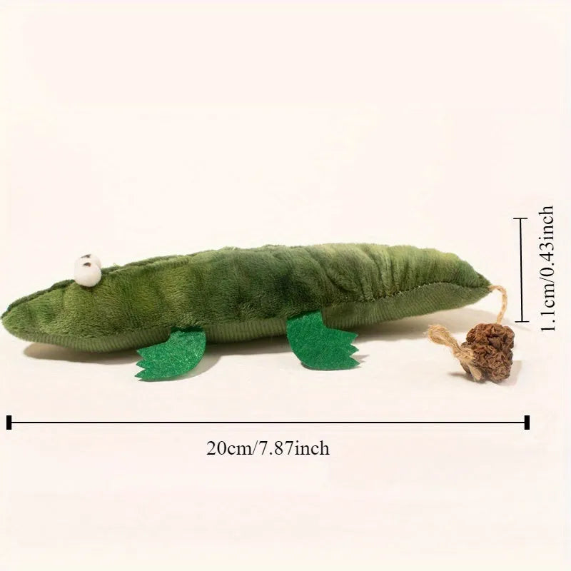 Green alligator-shaped cat toy with catnip and peppermint scent for oral cleansing