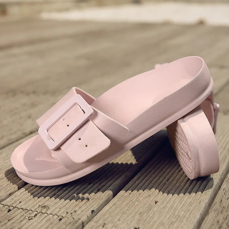 Women's grey blue EVA buckle slippers showing adjustable strap and soft sole.