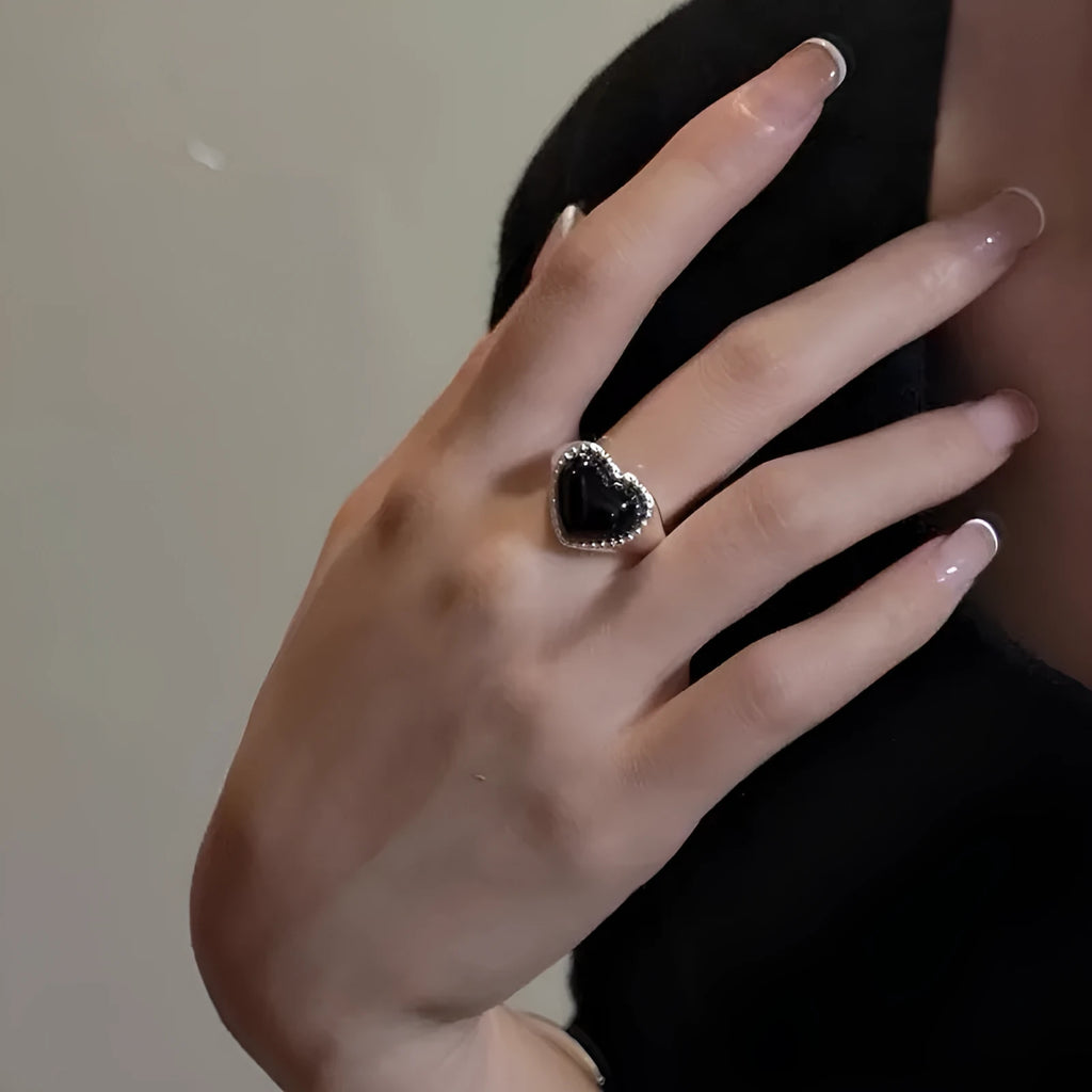Adjustable sterling silver ring with black agate heart centrepiece