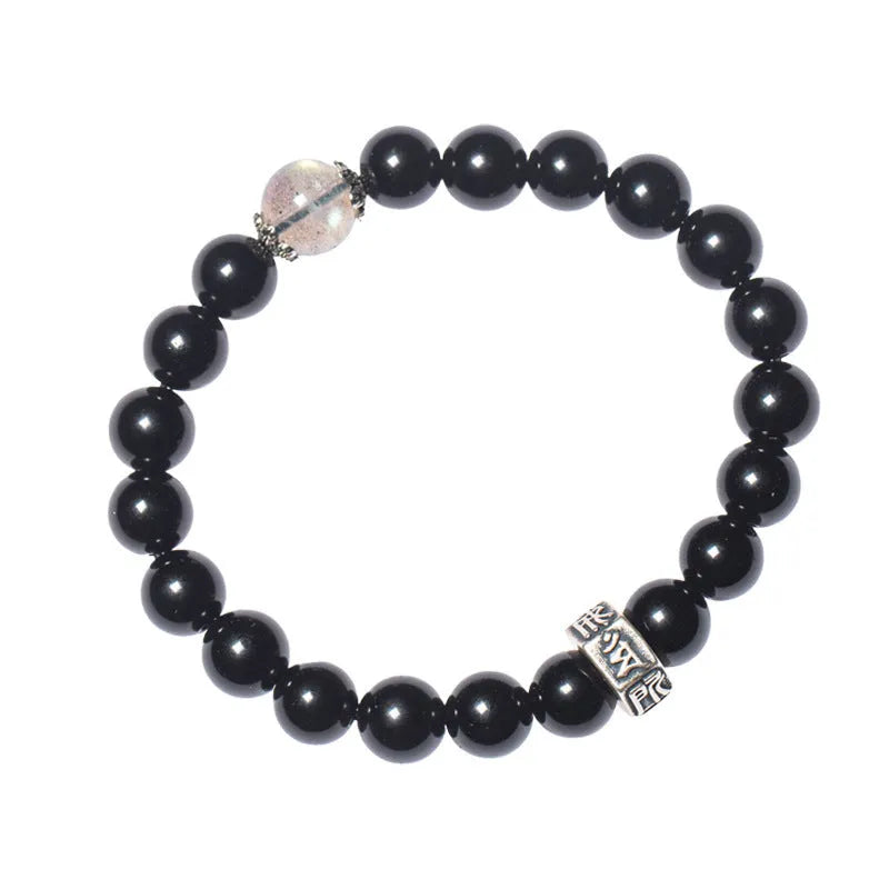 Close-up of an 8mm obsidian beaded bracelet with zodiac and Buddhist bodhisattva designs.